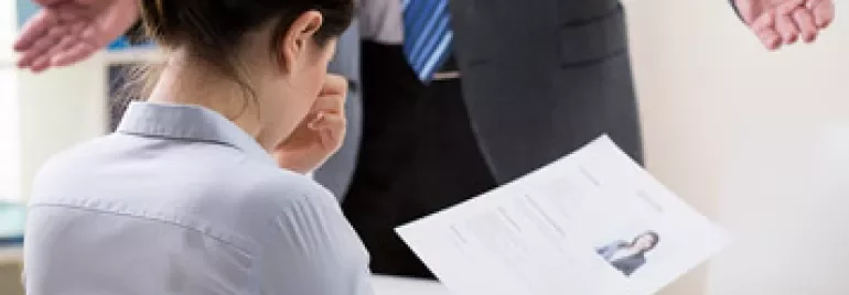 Woman reviewing her resume at a job interview