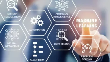 A person pointing at a digital interface with hexagons labeled: machine learning