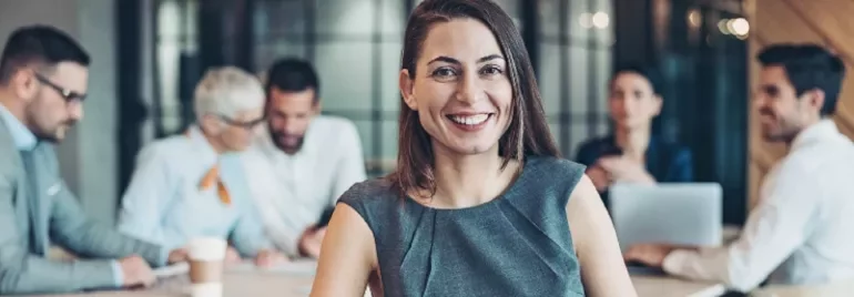Smiling woman in a grey dress