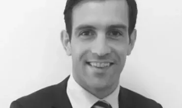 Black and white portrait of a man in a suit and tie