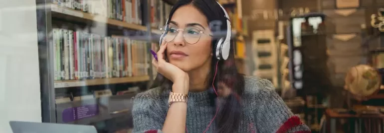 Woman wearing headphones and glasses